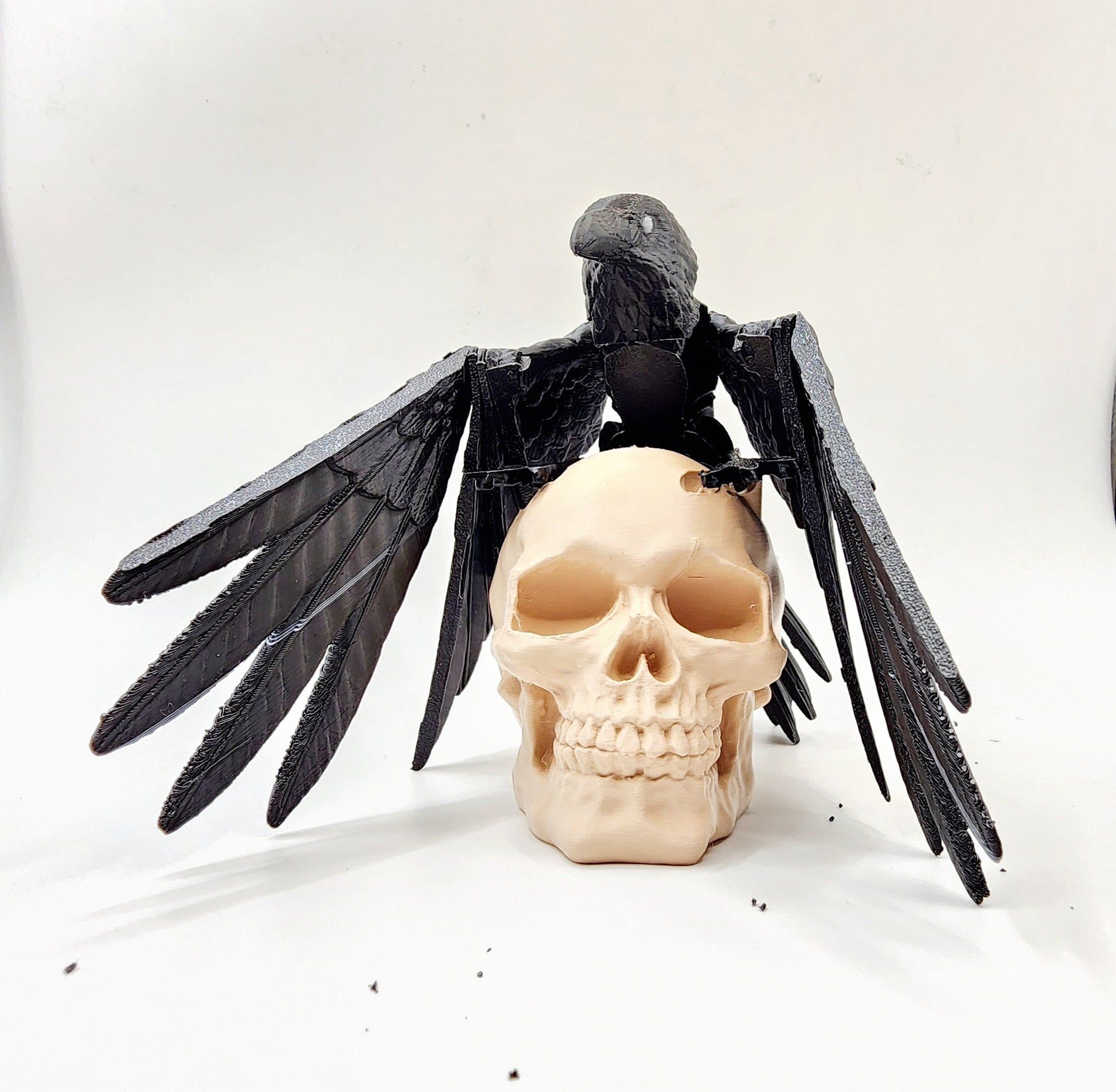 3D printed articulated Raven with articulated wings, fidget, sensory toy with optional skull base.