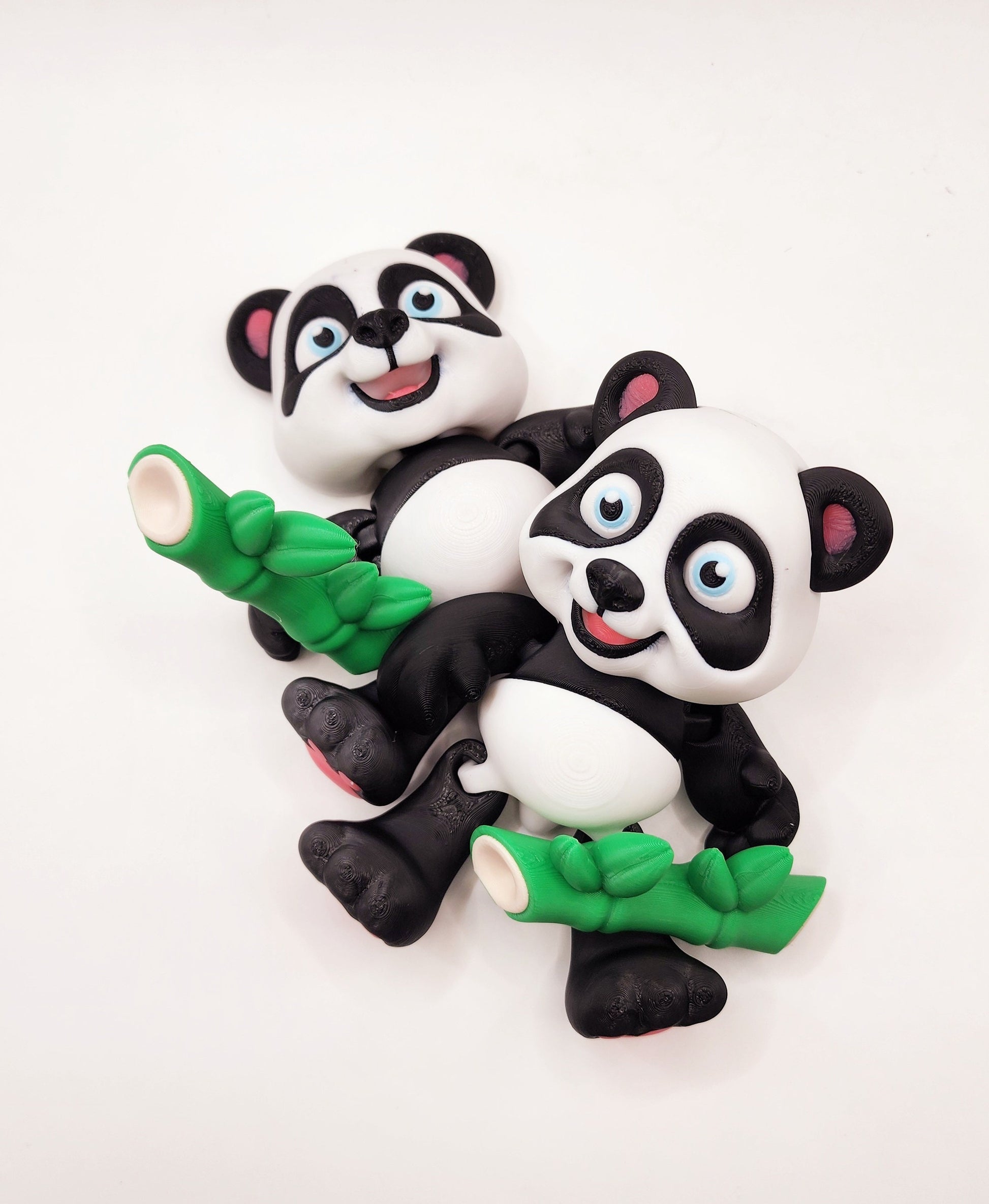 3D Printed articulated flexi baby Panda with bamboo fidget desk toy.