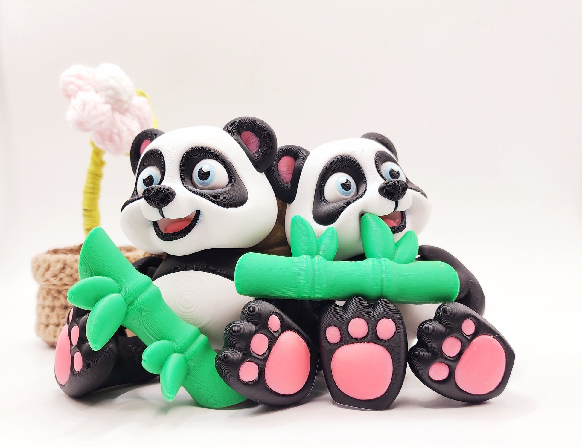 3D Printed articulated flexi baby Panda with bamboo fidget desk toy.