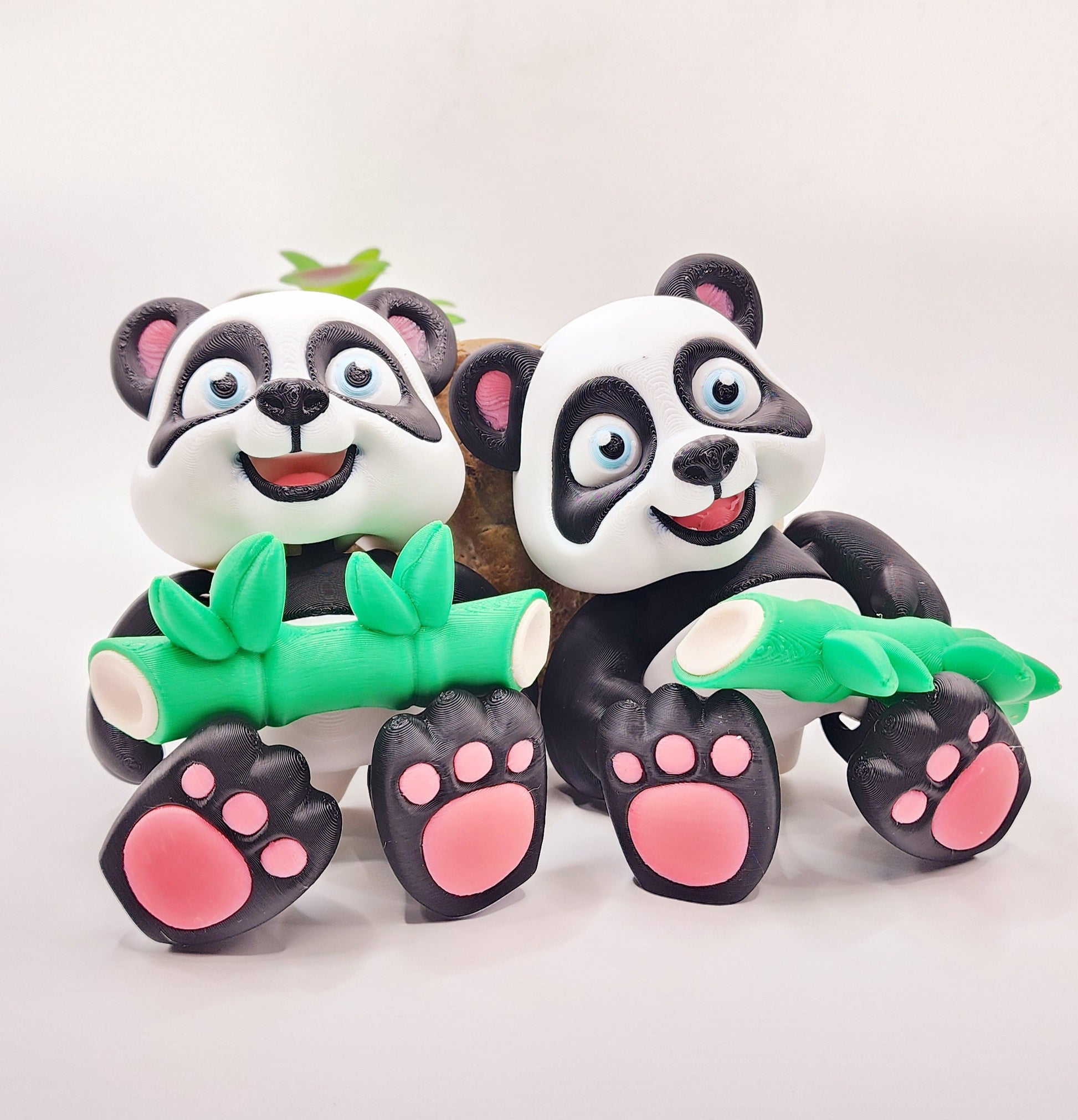 3D Printed articulated flexi baby Panda with bamboo fidget desk toy.