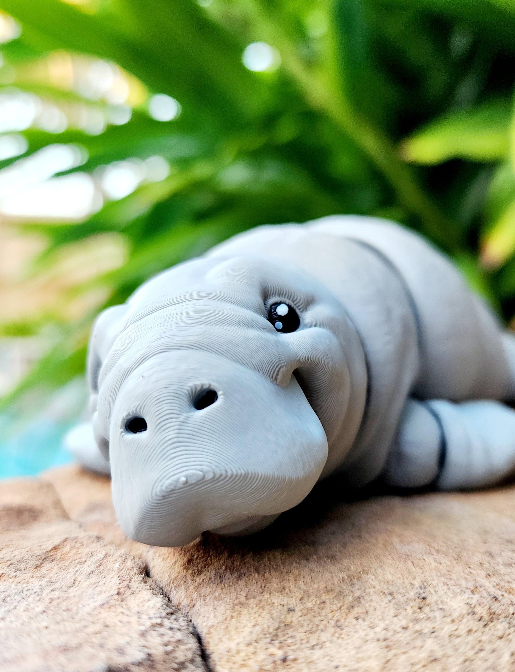 3D printed articulated Manatee fidget, sensory toy, desk toy.