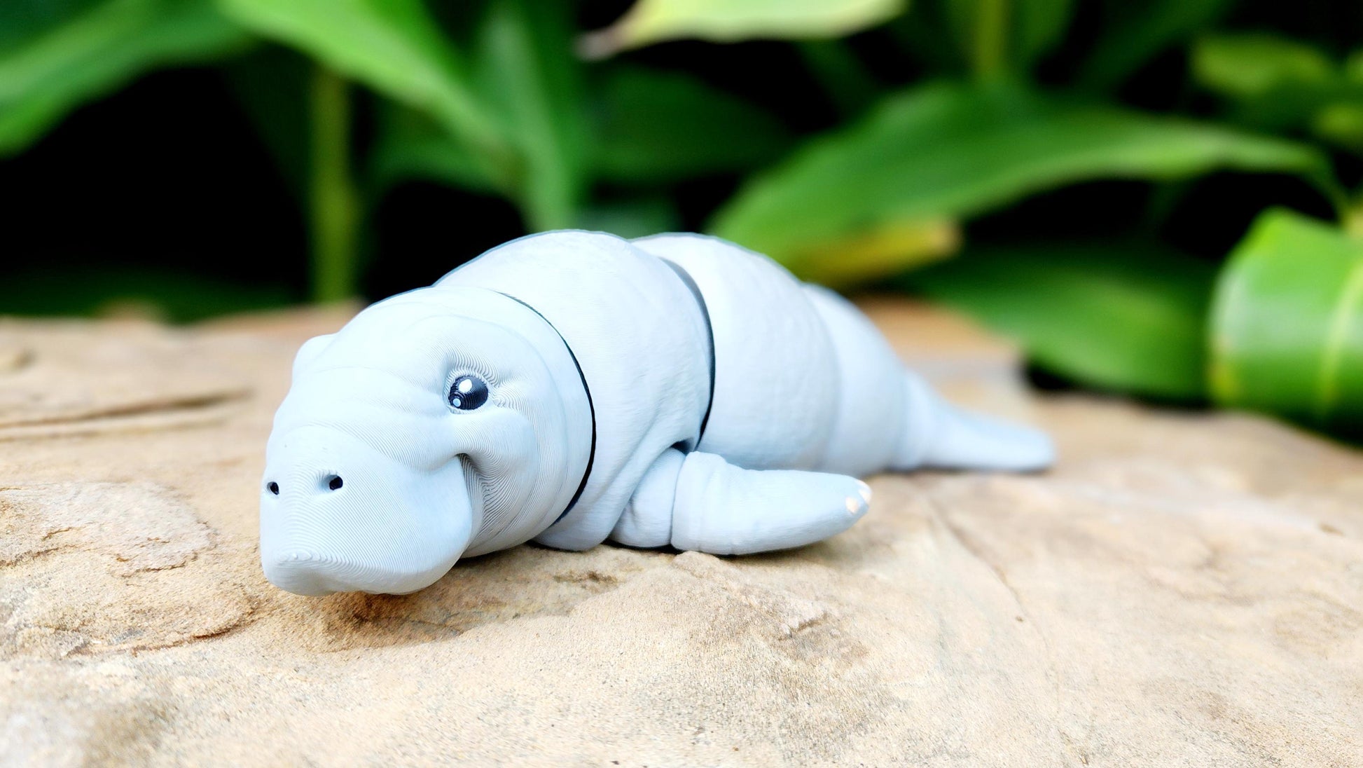 3D printed articulated Manatee fidget, sensory toy, desk toy.