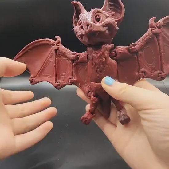 3D printed articulate bat fidget sensory toy.