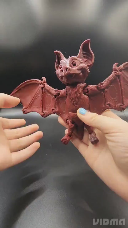 3D printed articulate bat fidget sensory toy.